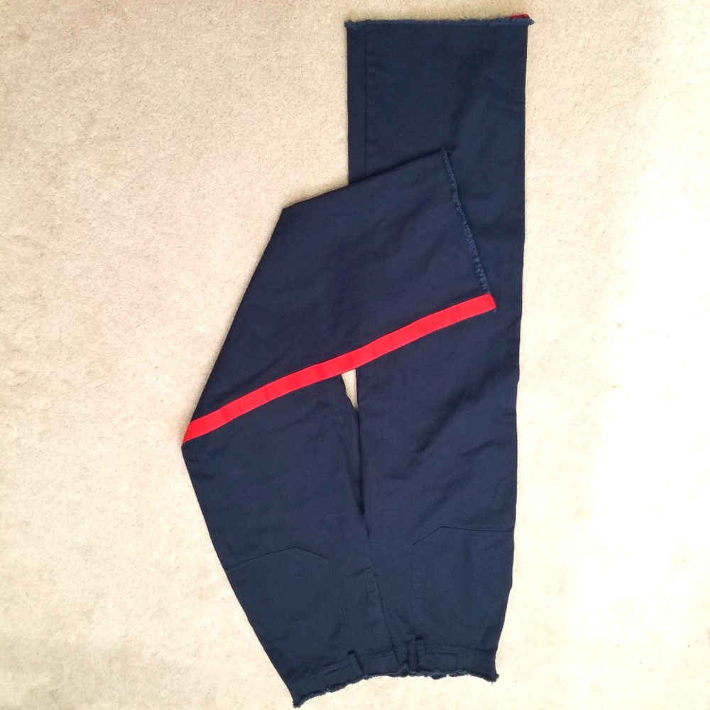 Know.one.cares  Y2K navy blue with red stripe down each side